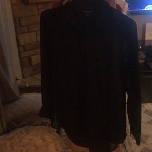 Slightly opaque black button down blouse.